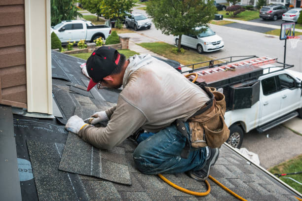 Professional Roofing technician working in East Greenwich, RI